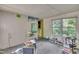 Cluttered living room with ample natural light and views of the surrounding greenery at 424 Raleigh View Rd, Raleigh, NC 27610
