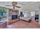 Spacious living room with a fireplace and a ceiling fan at 424 Raleigh View Rd, Raleigh, NC 27610