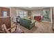 Bright living room with a large window, fireplace, and comfortable seating, perfect for relaxing or entertaining guests at 424 Raleigh View Rd, Raleigh, NC 27610