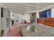 Bright living room featuring a brick fireplace and access to the outdoors at 424 Raleigh View Rd, Raleigh, NC 27610