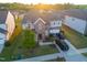 Aerial view of a well-maintained home with a brick facade and a large, manicured front lawn at 428 Parlier Dr, Apex, NC 27523