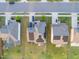 Aerial view of neighborhood homes equipped with solar panels, manicured lawns, and tree-lined streets at 428 Parlier Dr, Apex, NC 27523