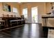 Sunlit dining area with a rustic wood table and views to outdoor porch at 428 Parlier Dr, Apex, NC 27523