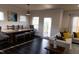 Dining room with table, chairs, and open access to screened-in back porch at 428 Parlier Dr, Apex, NC 27523