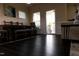 Dining area featuring hardwood floors, open layout, natural light, and views to back porch at 428 Parlier Dr, Apex, NC 27523