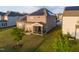 Aerial view of the home's backyard and screened-in porch with solar panels on the roof at 428 Parlier Dr, Apex, NC 27523