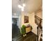 Bright foyer with dark wood floors, elegant lighting, staircase, and stylish decor at 428 Parlier Dr, Apex, NC 27523