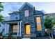 Charming two-story home with a brick facade, covered porch, and well-manicured landscaping at 428 Parlier Dr, Apex, NC 27523