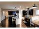 Spacious kitchen featuring dark wood cabinetry, stainless steel appliances, and granite countertops at 428 Parlier Dr, Apex, NC 27523