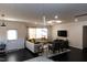 Open living room featuring modern lighting, hardwood floors, and comfortable seating at 428 Parlier Dr, Apex, NC 27523
