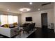 Comfortable living room boasting hardwood floors, neutral colors, and recessed lighting at 428 Parlier Dr, Apex, NC 27523