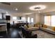 Open-concept living area with modern lighting, comfortable seating, and a dining table at 428 Parlier Dr, Apex, NC 27523