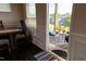 View from dining area to a screened porch with outdoor seating and neighborhood views at 428 Parlier Dr, Apex, NC 27523
