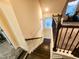 Staircase with rich wood steps and decorative railing leading to the upstairs at 428 Parlier Dr, Apex, NC 27523