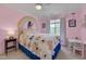Bright and cheerful bedroom with a colorful mural and decor creating a fun and inviting space at 4306 Brynwood Ave, Durham, NC 27713