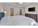 Bright bedroom featuring a large bed, TV, and ensuite bathroom for comfort and convenience at 4306 Brynwood Ave, Durham, NC 27713