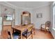 Charming dining room featuring hardwood floors and an open layout adjacent to the kitchen at 4306 Brynwood Ave, Durham, NC 27713