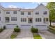 Townhouse featuring a multi-car garage and balconies enhancing outdoor living at 4306 Brynwood Ave, Durham, NC 27713