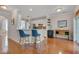 Charming kitchen with sleek countertops, modern appliances, a breakfast bar, and stylish blue bar stools at 4306 Brynwood Ave, Durham, NC 27713