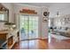 Living area and access to the outdoor patio with sliding glass door, seamlessly connecting indoor and outdoor spaces at 4306 Brynwood Ave, Durham, NC 27713