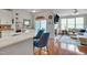 Open living space with bar seating, adjacent living room, and a sliding glass door at 4306 Brynwood Ave, Durham, NC 27713