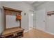 Functional mudroom with a coat rack, bench, and shoe storage, designed for organization at 4306 Brynwood Ave, Durham, NC 27713