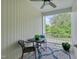 Cozy outdoor patio featuring a ceiling fan and a view of lush greenery, perfect for relaxing at 4306 Brynwood Ave, Durham, NC 27713