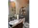 Bathroom featuring a vanity with ample counter space, decorative accents, and plenty of storage at 4855 Mike Ln, Nashville, NC 27856