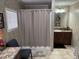 Bathroom featuring a shower with curtain, a vanity with natural decor, and ample space at 4855 Mike Ln, Nashville, NC 27856