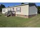 Charming single-story home with a well-maintained lawn, front porch, red shutters, and a brick foundation at 4855 Mike Ln, Nashville, NC 27856
