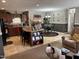 Open-concept living room featuring a dining area, kitchen island and brown accent furniture at 4855 Mike Ln, Nashville, NC 27856