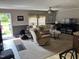 Cozy living room with a plush sofa, recliner, and a ceiling fan, creating a comfortable and inviting space at 4855 Mike Ln, Nashville, NC 27856