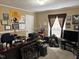 Spacious home office features natural light, perfect for a professional or hobby workspace at 4855 Mike Ln, Nashville, NC 27856