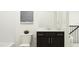 Well-lit bathroom with a modern vanity, dark cabinets, and a clean, white toilet and shower at 521 Morning Light Dr, Angier, NC 27501