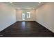 Empty living room featuring recessed lighting, neutral walls, and dark wood floors, ready for personalization at 521 Morning Light Dr, Angier, NC 27501