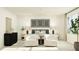 Bright, airy main bedroom with neutral decor, stylish furnishings, and a large window for natural light at 521 Morning Light Dr, Angier, NC 27501