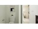 Elegant bathroom showcases a toilet with modern art hanging above, with a bedroom view at 521 Morning Light Dr, Angier, NC 27501