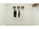 Bright walk-in closet features wire shelving, hanging rod, and decorative woven baskets at 521 Morning Light Dr, Angier, NC 27501