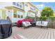 A spacious back deck provides a serene outdoor space with comfortable seating and vibrant azaleas at 521 Village Loop Dr, Apex, NC 27502