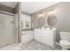Neutral bathroom with a double vanity, soaking tub, and a glass-enclosed shower at 521 Village Loop Dr, Apex, NC 27502
