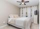 Cozy bedroom features neutral walls and carpet, and a comfortable bed with neutral bedding and pillows at 521 Village Loop Dr, Apex, NC 27502