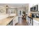 Bright kitchen boasts granite countertops, stainless appliances, and hardwood floors at 521 Village Loop Dr, Apex, NC 27502