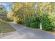 A well-maintained walking trail through a wooded area offers residents a peaceful outdoor experience at 521 Village Loop Dr, Apex, NC 27502