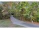 A scenic walking trail meanders through a lush green forest, perfect for a relaxing nature walk at 521 Village Loop Dr, Apex, NC 27502