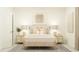 Bright bedroom with stylish nightstands, lamps, neutral decor, and a comfortable bed at 529 Morning Light Dr, Angier, NC 27501