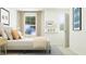 Bright bedroom featuring a bed, rug and neutral decor, creating a serene and inviting space at 529 Morning Light Dr, Angier, NC 27501