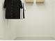 A minimalist walk in closet with wire shelving and clothing at 529 Morning Light Dr, Angier, NC 27501