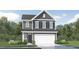 Charming two-story home featuring gray siding, a two-car garage, and manicured landscaping for curb appeal at 529 Morning Light Dr, Angier, NC 27501