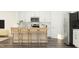 Modern kitchen featuring an island with barstool seating and stainless steel appliances for an efficient workspace at 529 Morning Light Dr, Angier, NC 27501