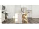 Bright and modern kitchen with an island, stainless steel appliances, and ample counter space at 529 Morning Light Dr, Angier, NC 27501